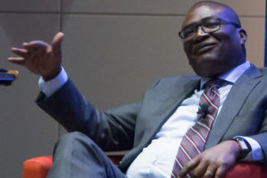 Close-up of Kerwin Charles sitting in a red chair