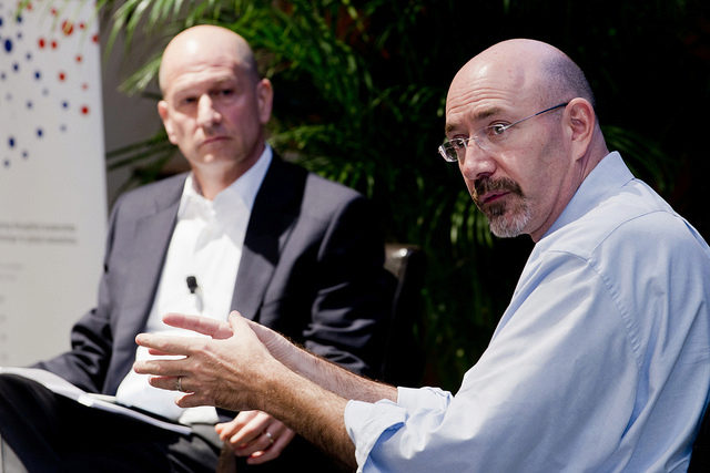 Michael Feinberg gestures to an audience with Bobby Turner looking on beside him