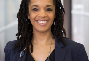 Stephanie Creary Headshot close up photo of professor Stephanie Creary, wearing a blue blazer and a black top