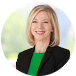 photo of Penn President Amy Gutmann, wearing a green top and black blazer