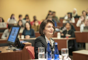 Rohini Anand sitting at the front of a classroom of students