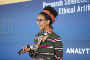 Close-up of Timnit Gebru talking at Wharton